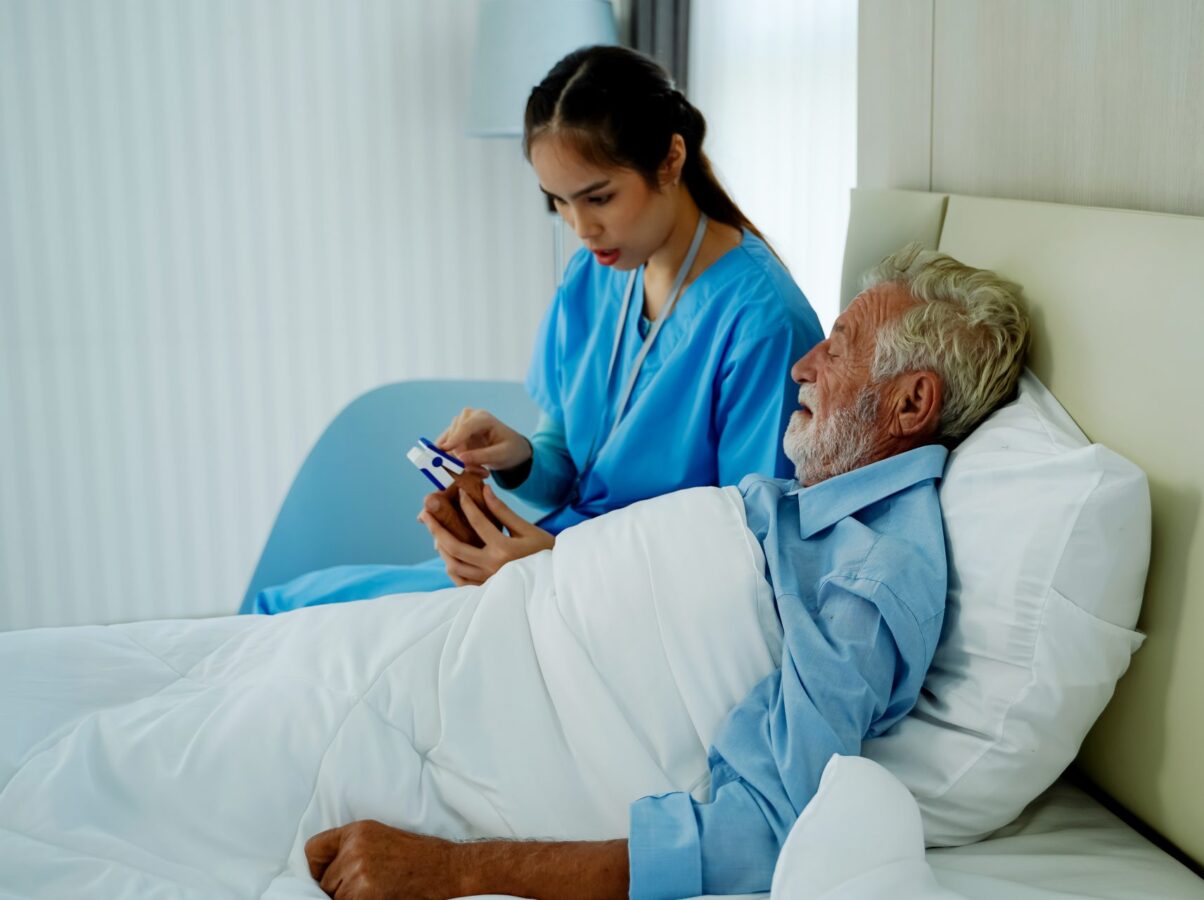 female-nurse-uses-heart-rate-monitor-elderly-patient-check-the-heartbeat-check-the-old-people-retire-at-home-elderly-heart-disease-heart-disease-concept
